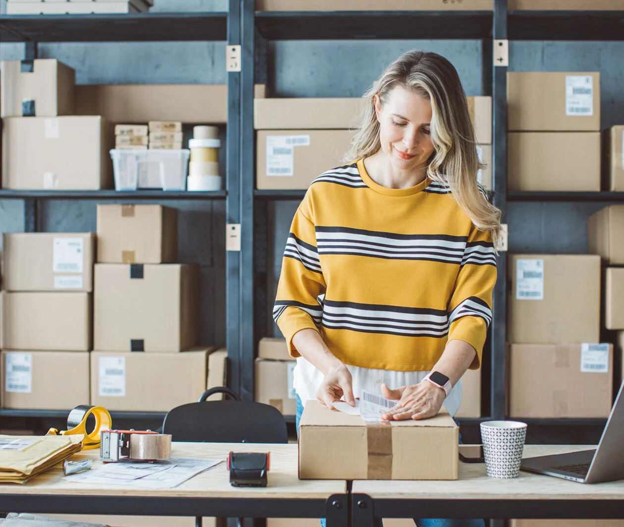 Person packing product for shipping