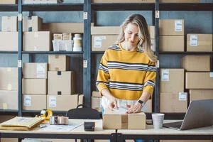 Person packing product for shipping