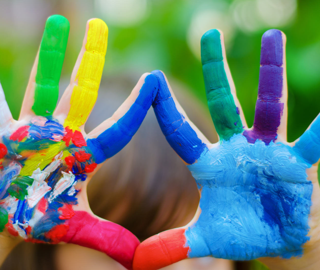 Image showing a child's hands, covered in paint