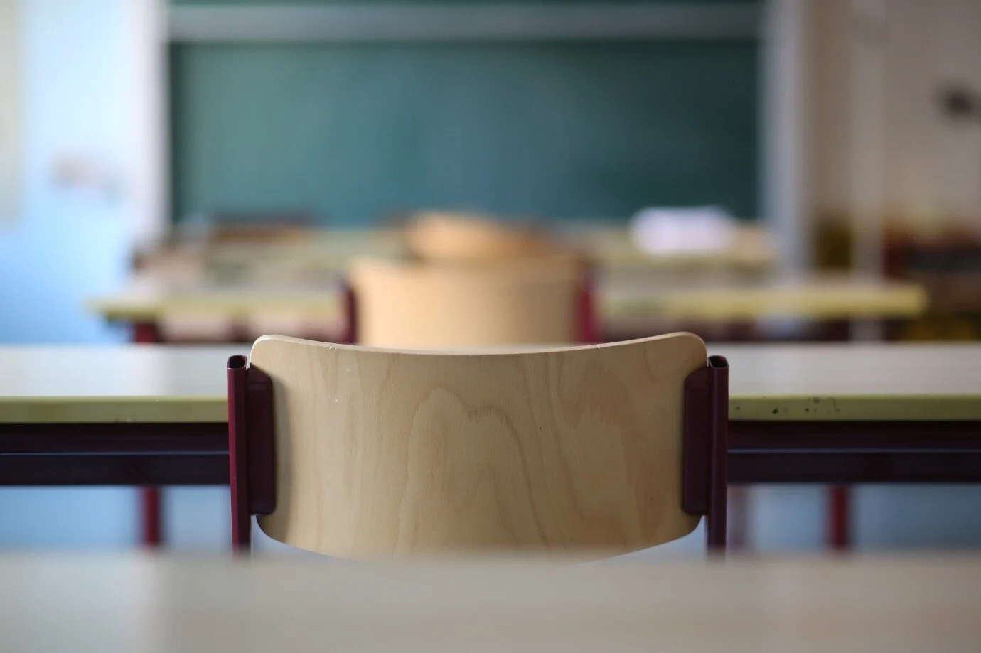 An empty chair in an empty classroom