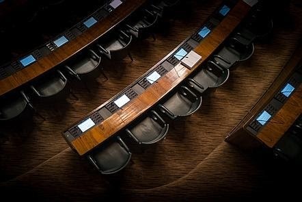 Parliamentary seats shown from above, representing decision-making.