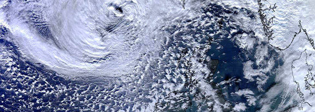 Weather: a satellite image of clouds above the earth