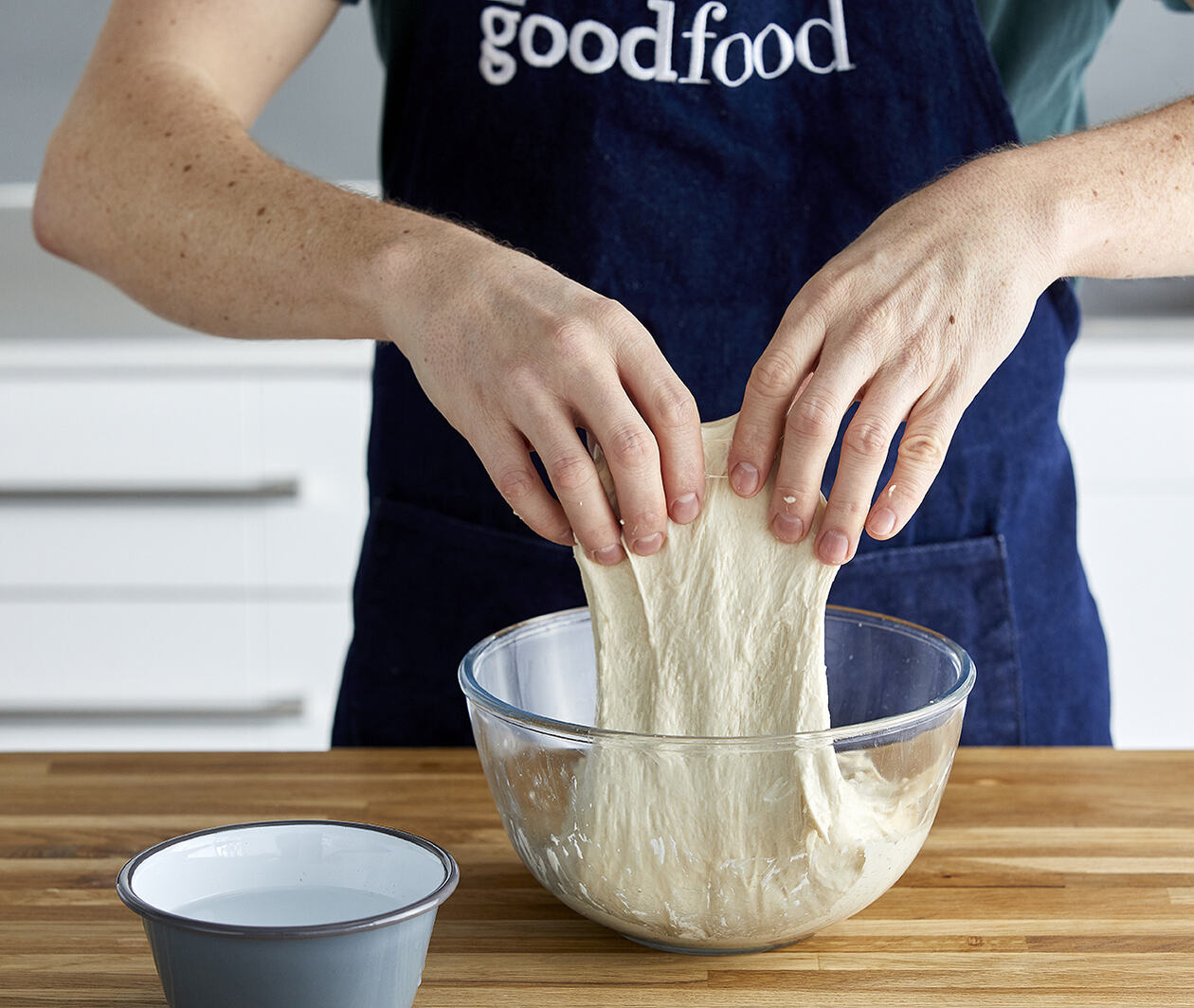 Person kneading bread dough