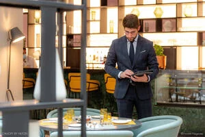 Waiter holding menu in a restaurant 