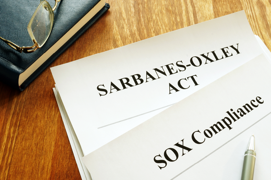 Sarbanes-Oxley Act and SOX compliance policy on table.