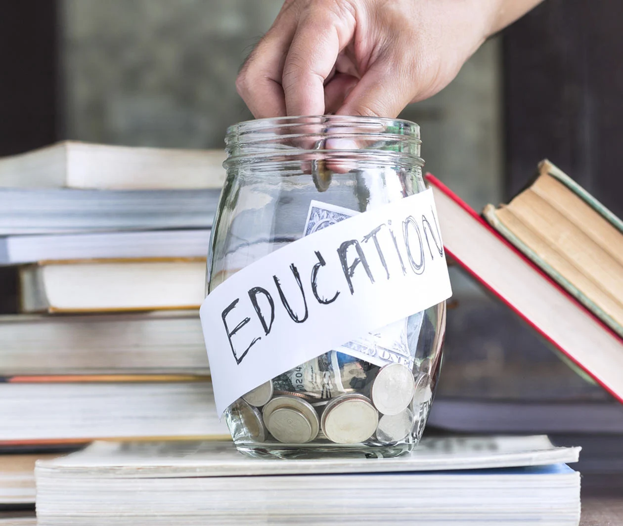 Jar containing money that says education