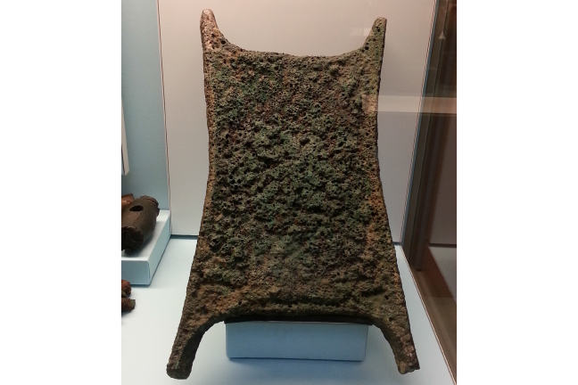 Oxhide-shaped copper ingot.