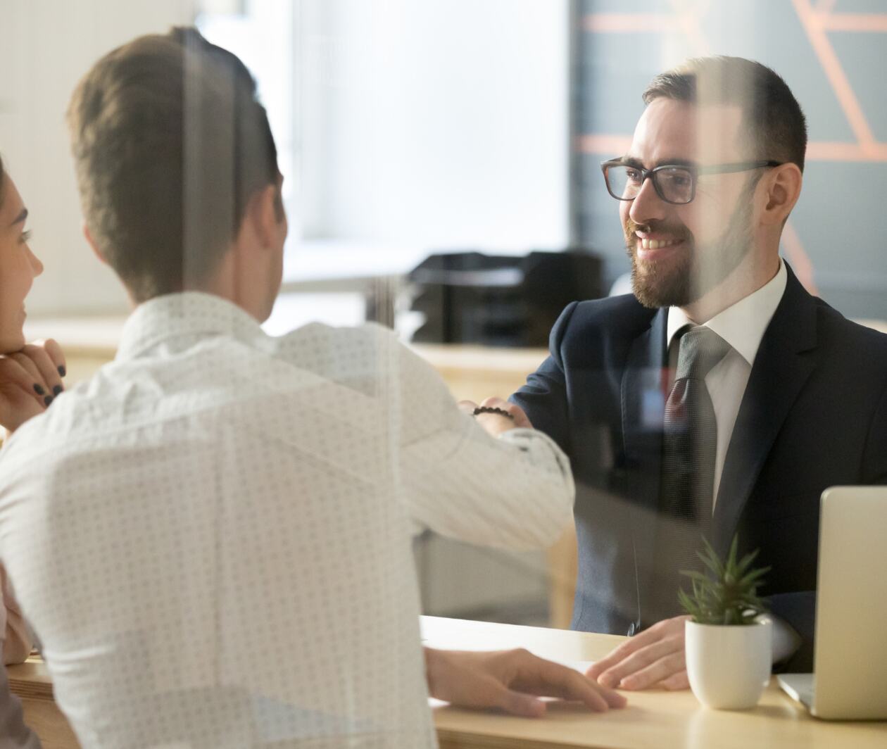 three business professionals having a discussion