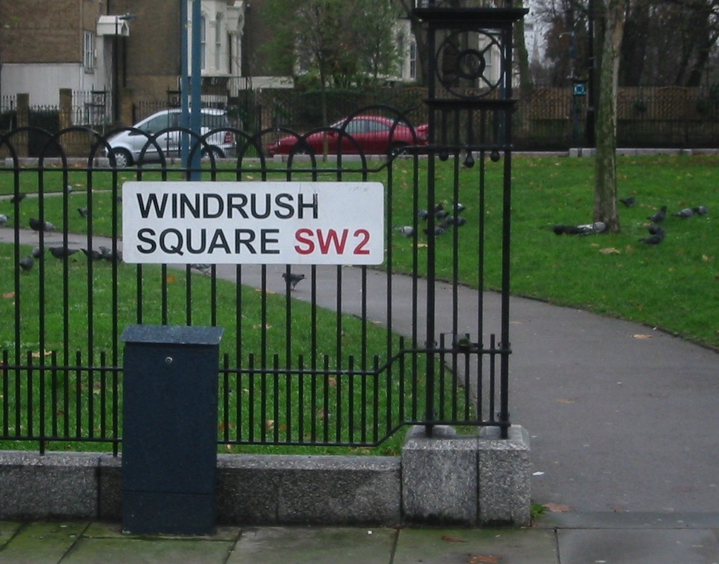 A close up of Windrush Square roadsign in Brixton, London