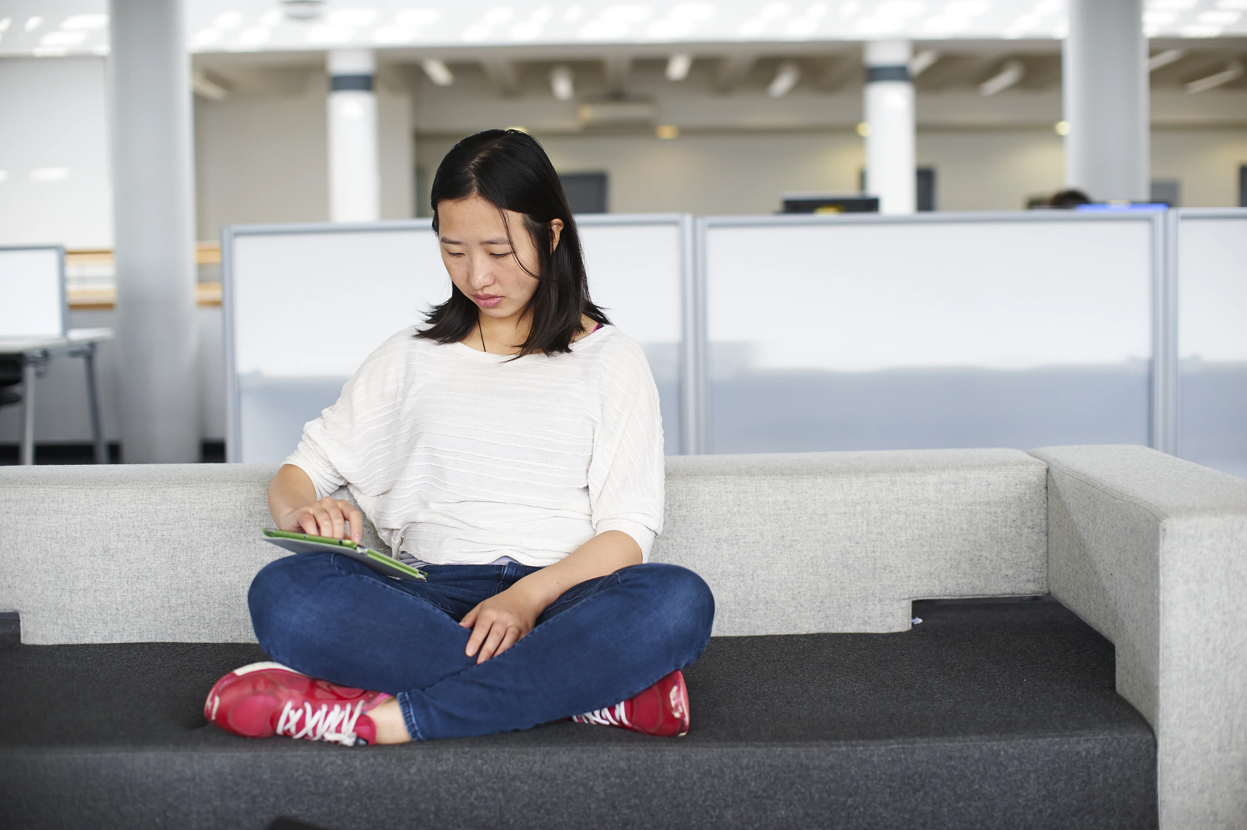 student sat with a tablet