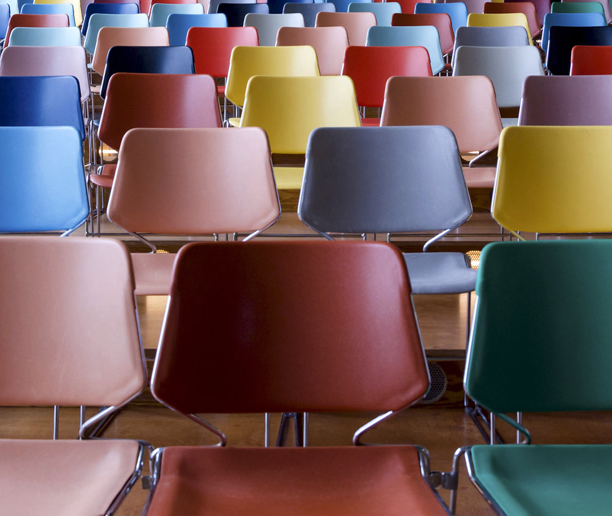 Rows of multicolour chairs