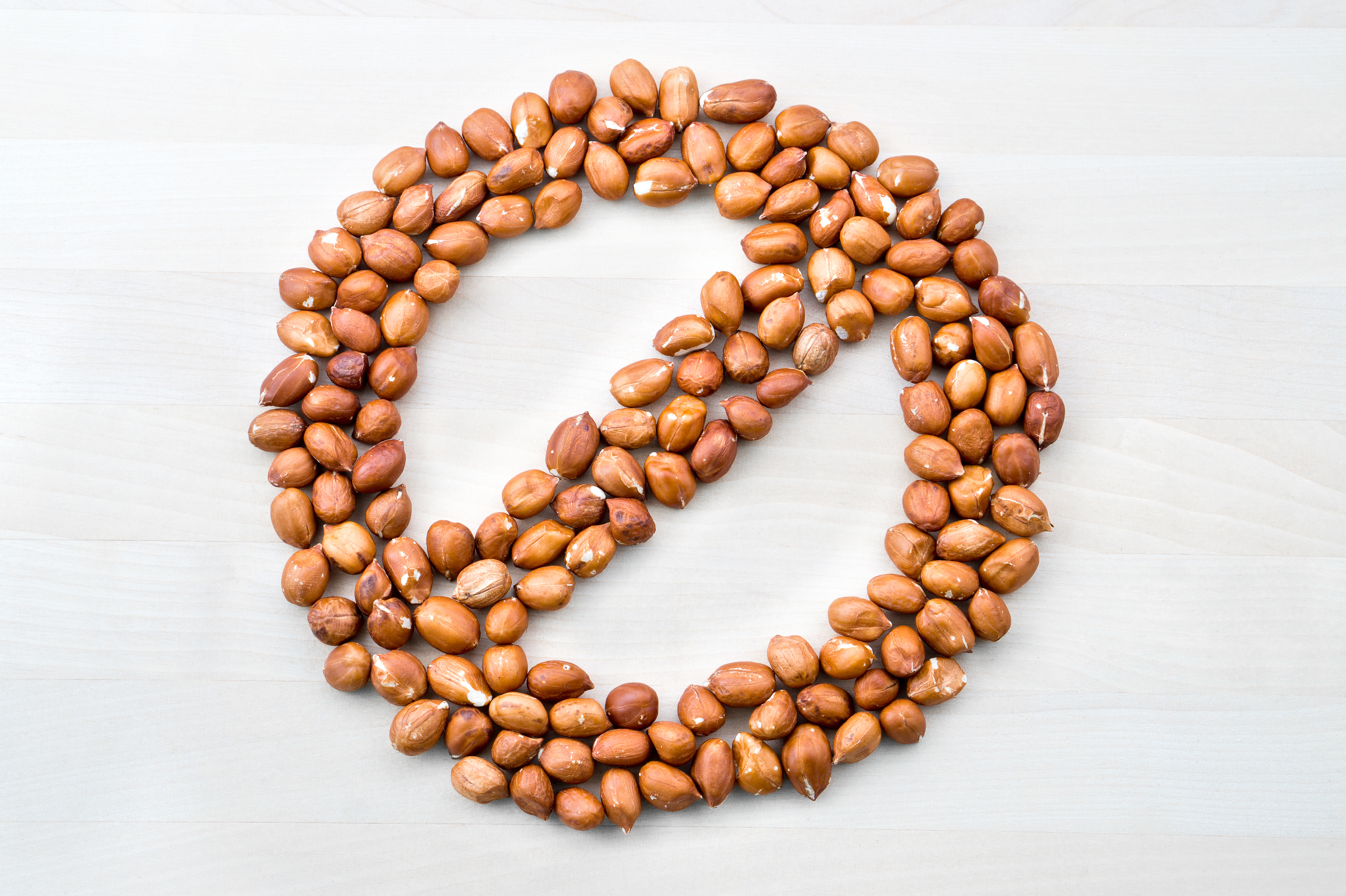 Nuts arranged in a stop sign image