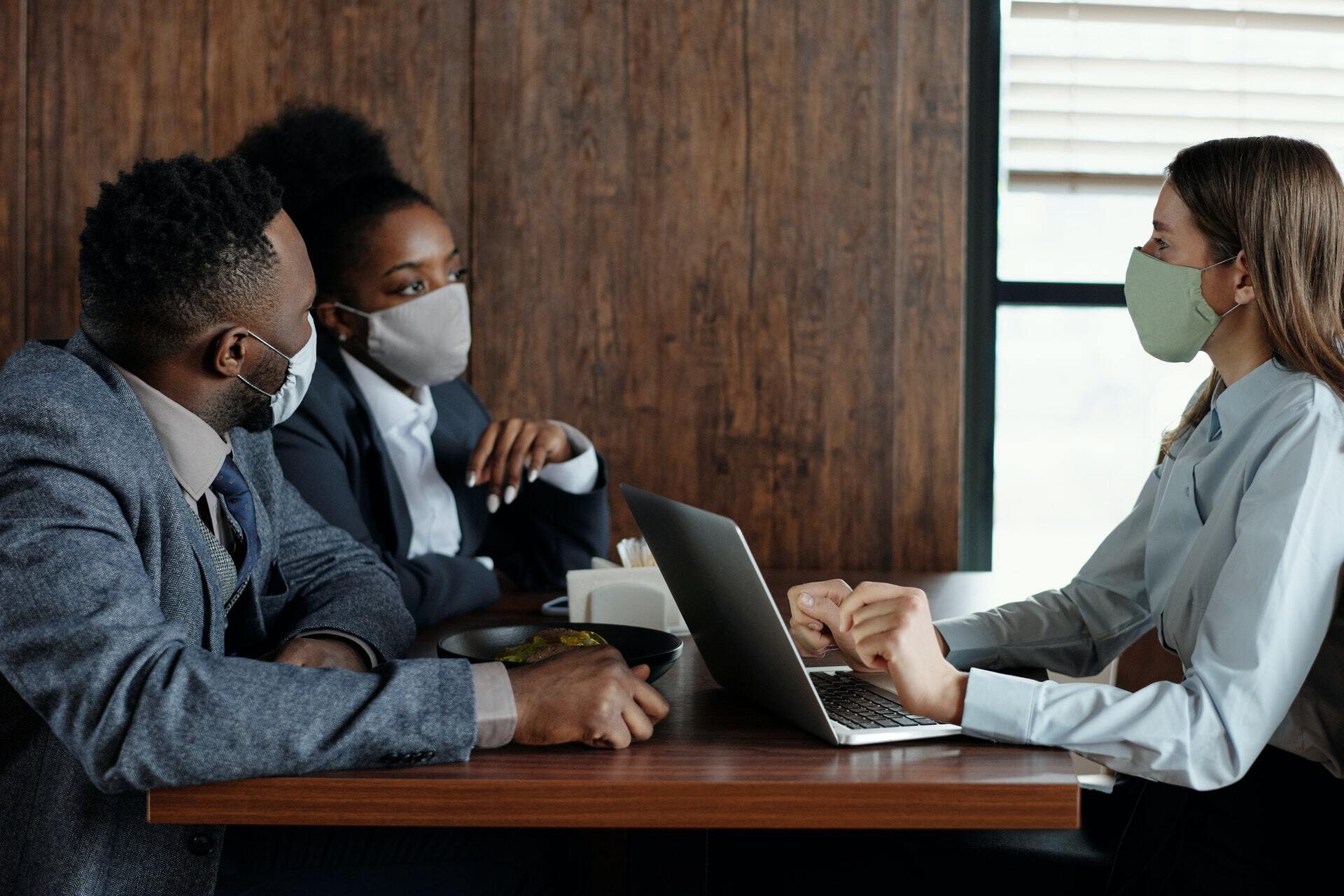 Colleagues Wearing Face Masks and Talking