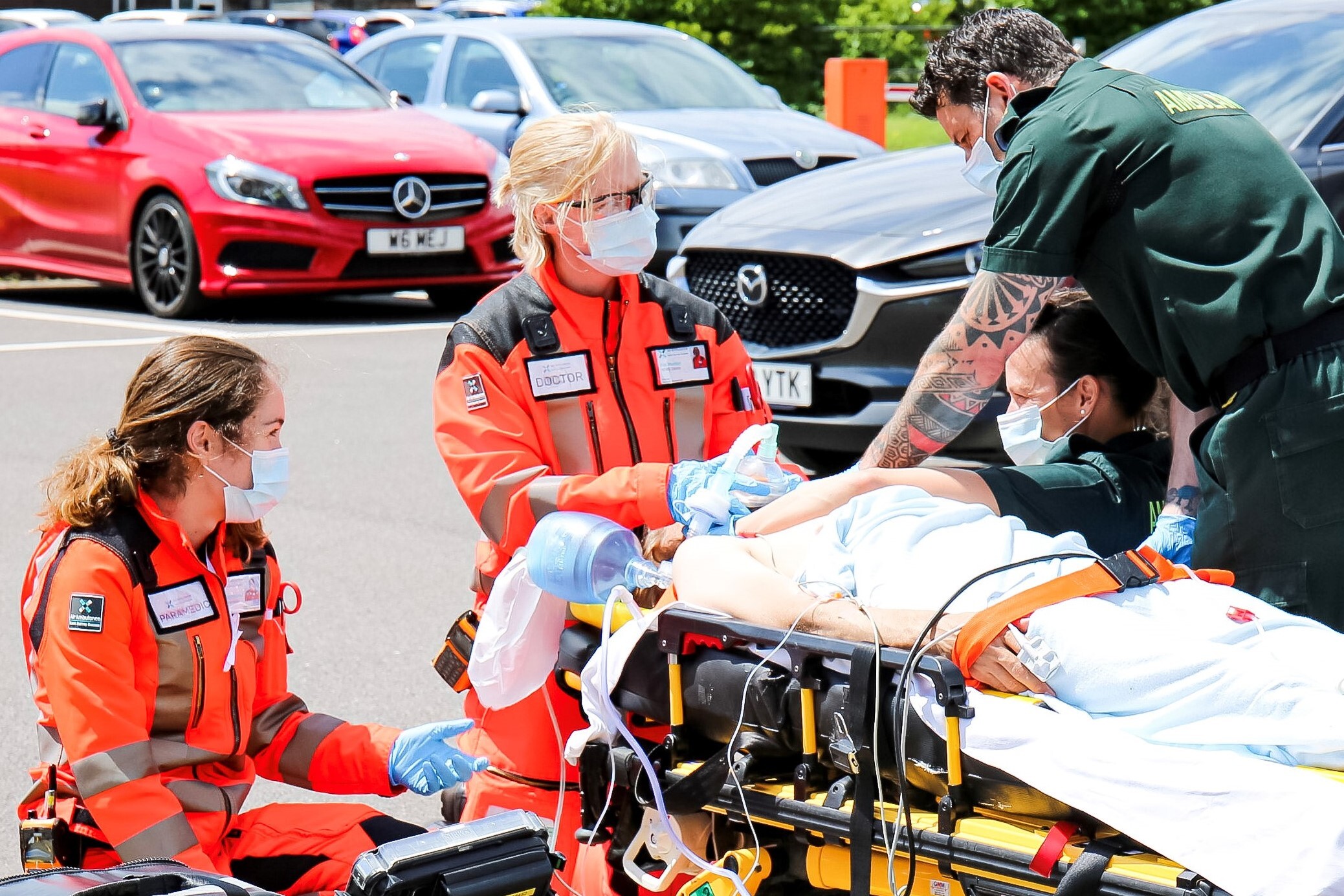 Pre-hospital team in RSI kit-dump with packaged patient, pre-oxygenation in progress