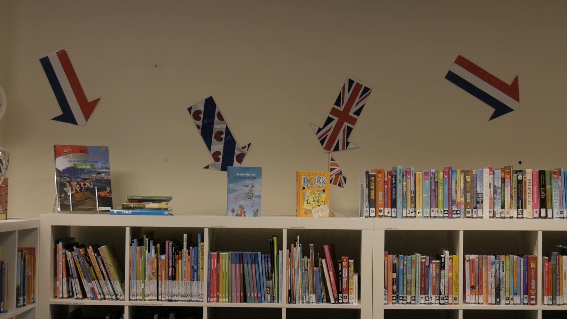 Bookcase with books in three languages