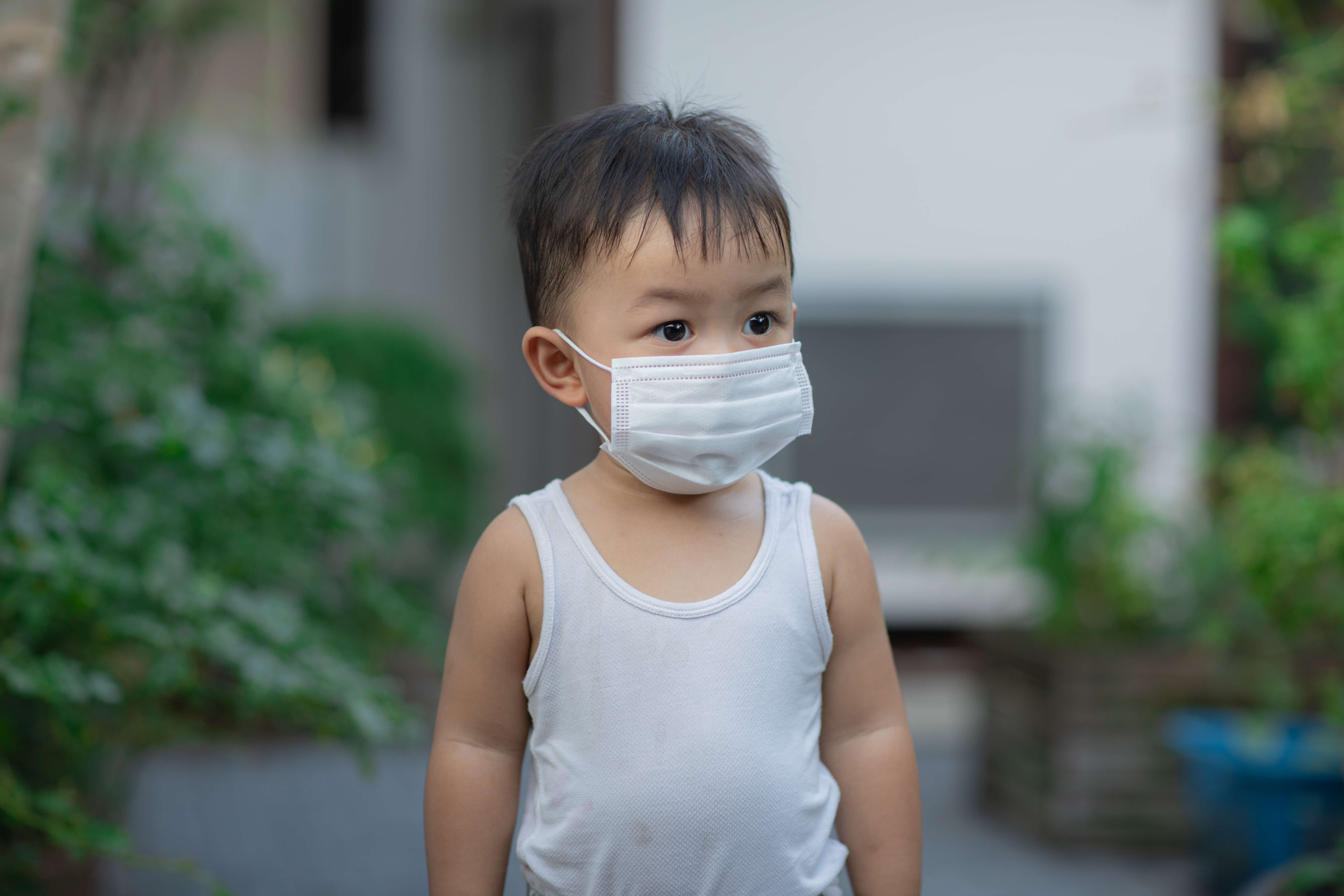 Young boy wearing a face mask