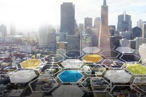 Tessellating hexagon shapes fading into a background of a modern city