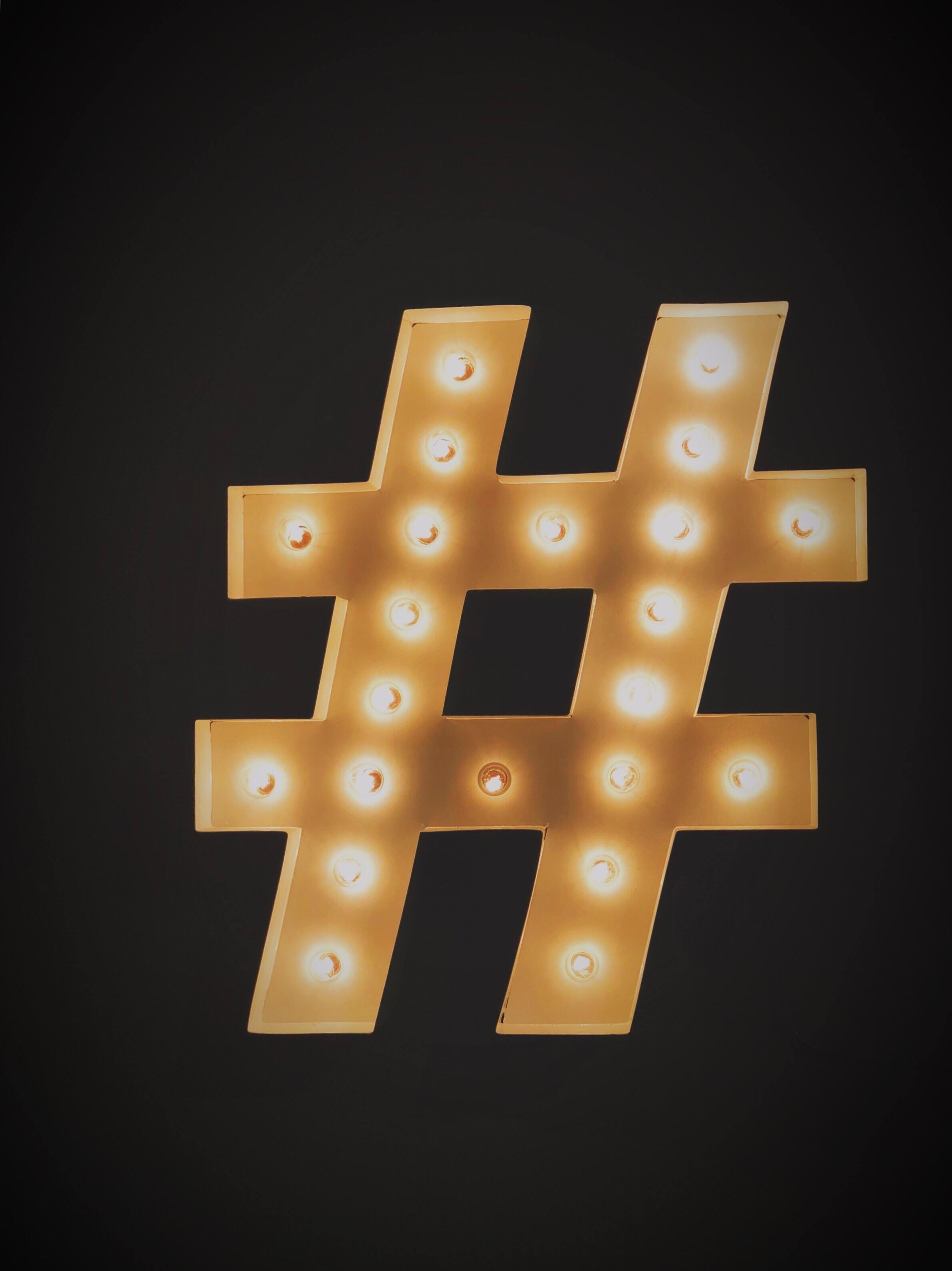 Hashtag sign on black background