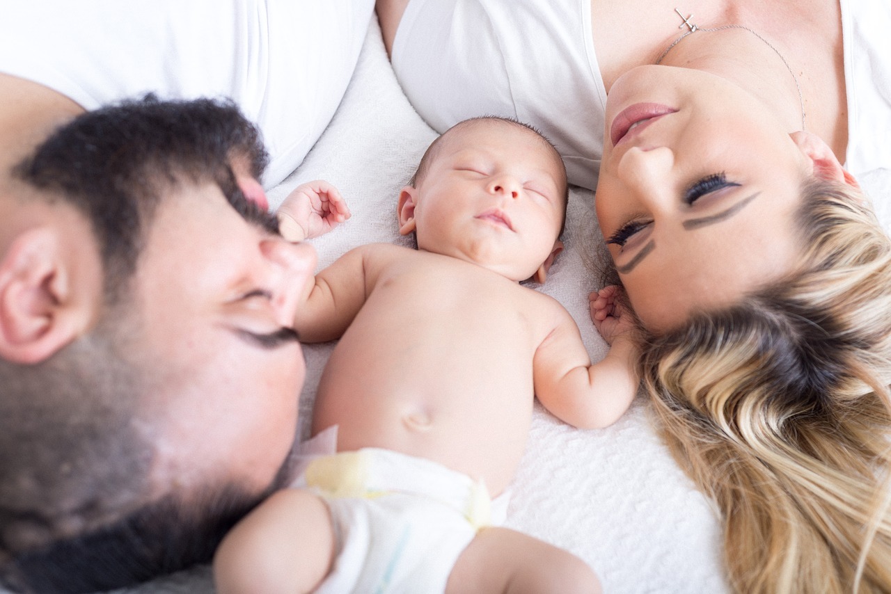 image of a man, woman and baby