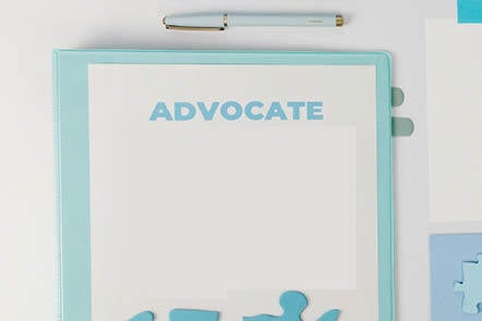 book with a title 'advocate' on a table