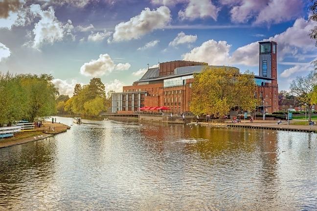 The river Avon with the Royal Shakespeare Company theatre in the background, Stratford upon Avon, UK
