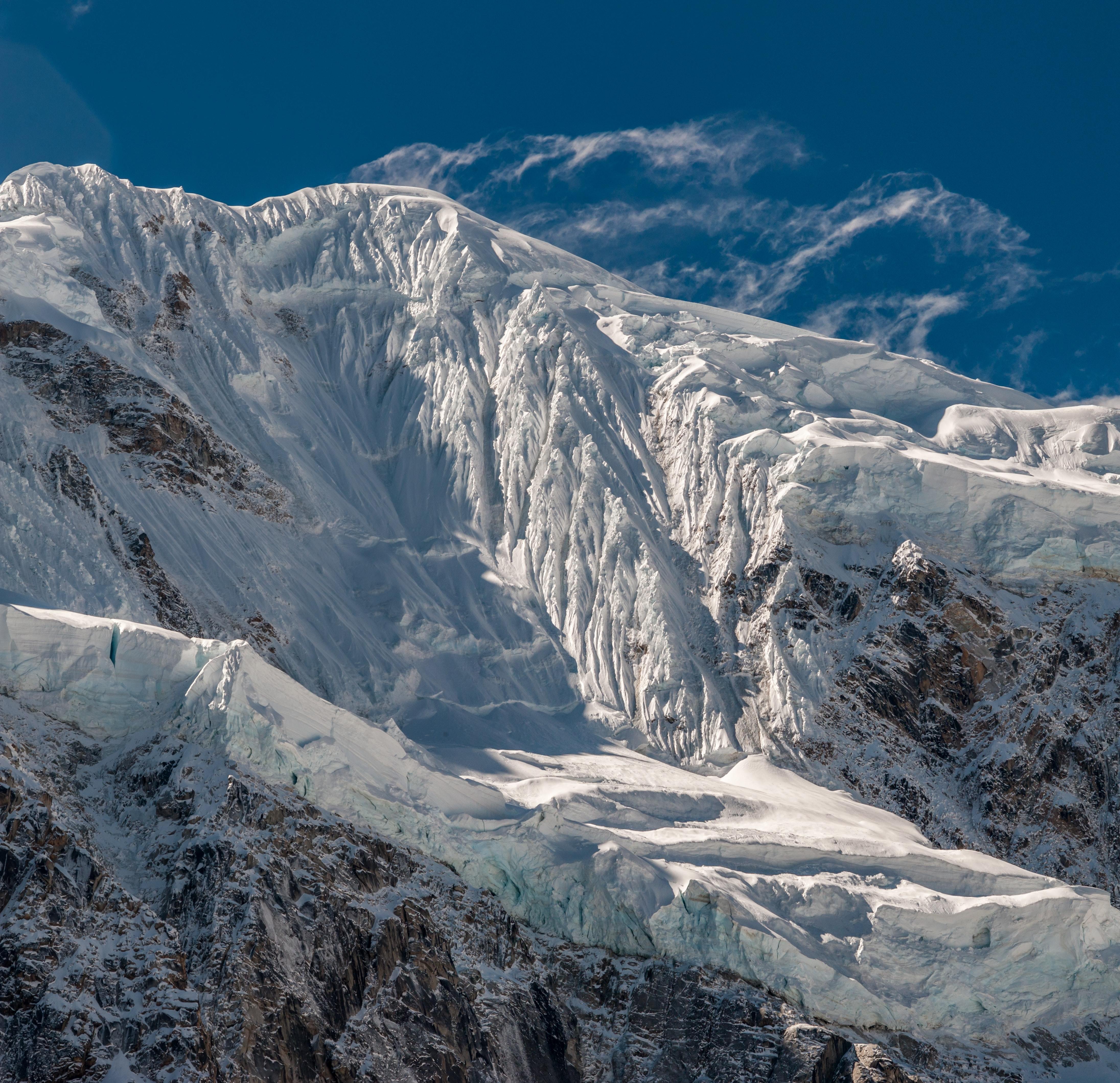 An image of a glacier surrounded by steep mountains.