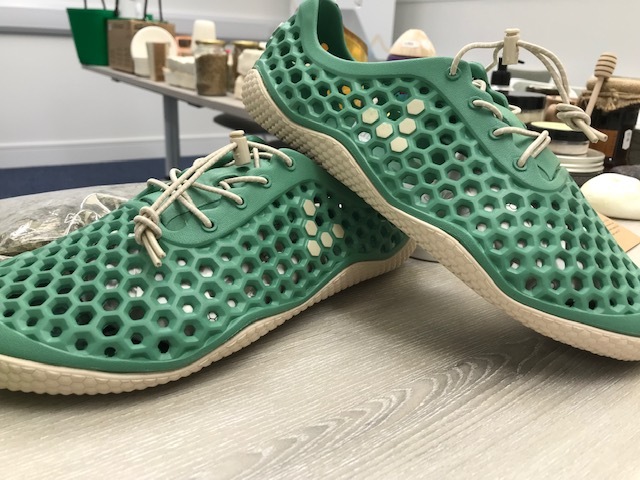 A pair of shoes made from foam using algae