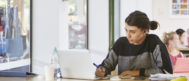 A student studying at a desk