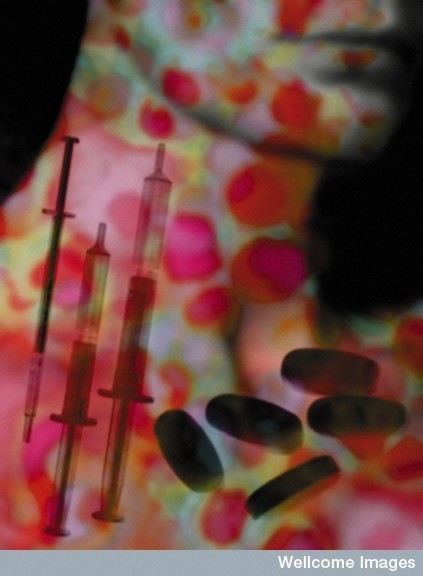 Artsy image depicted colourful syringes and tablets.