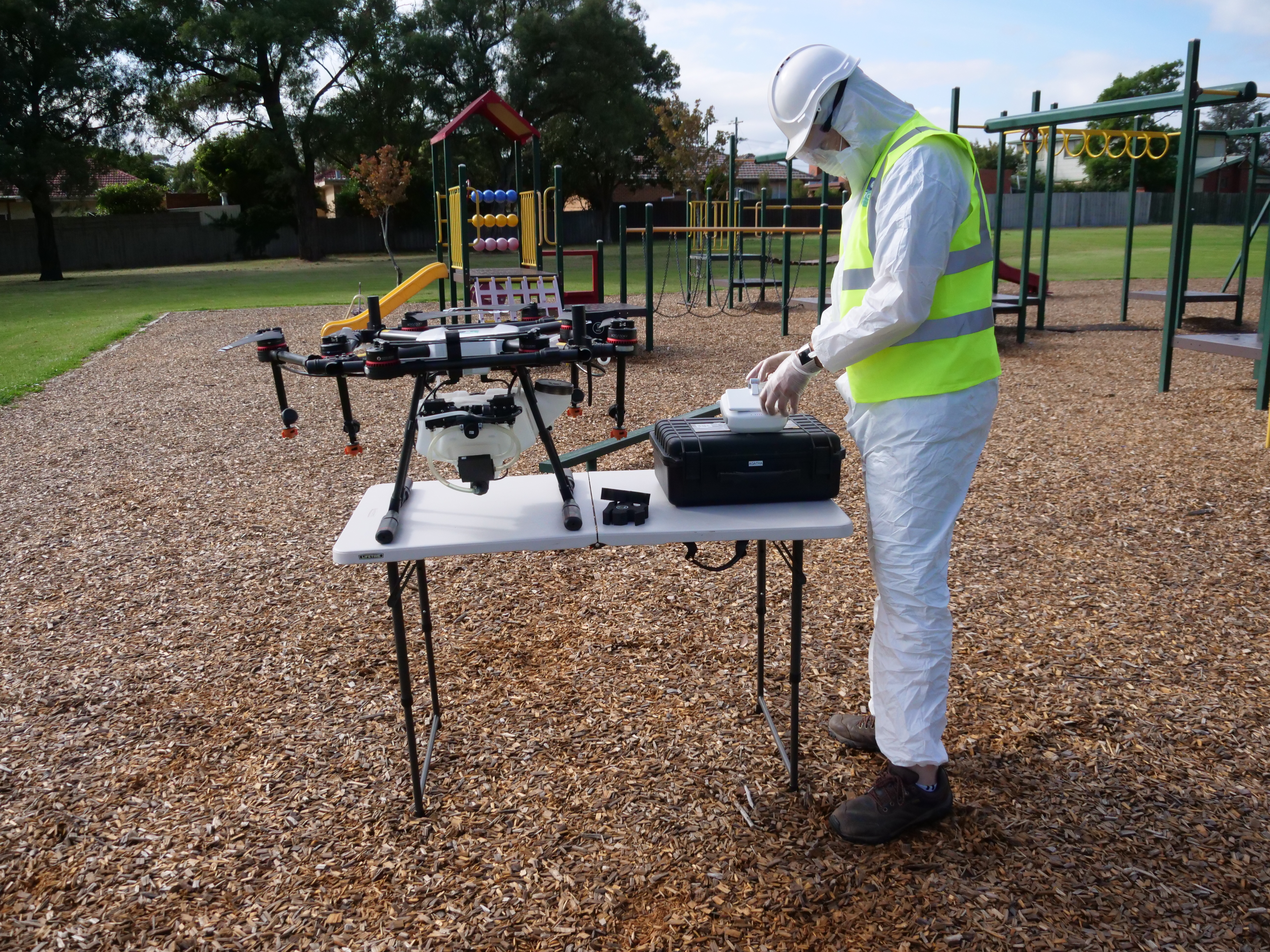 A person preparing to operate a disinfection drone