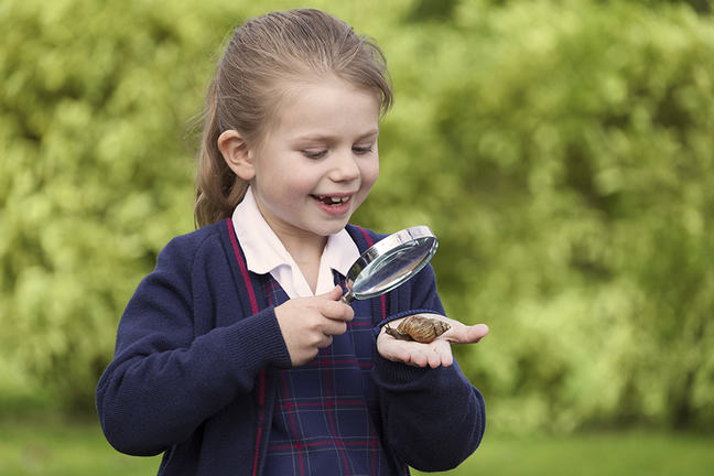Girl with a magnifying glass