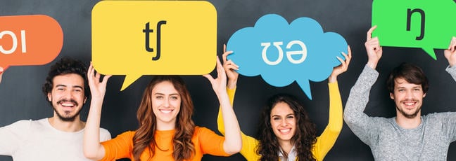 Four people holding speech bubbles