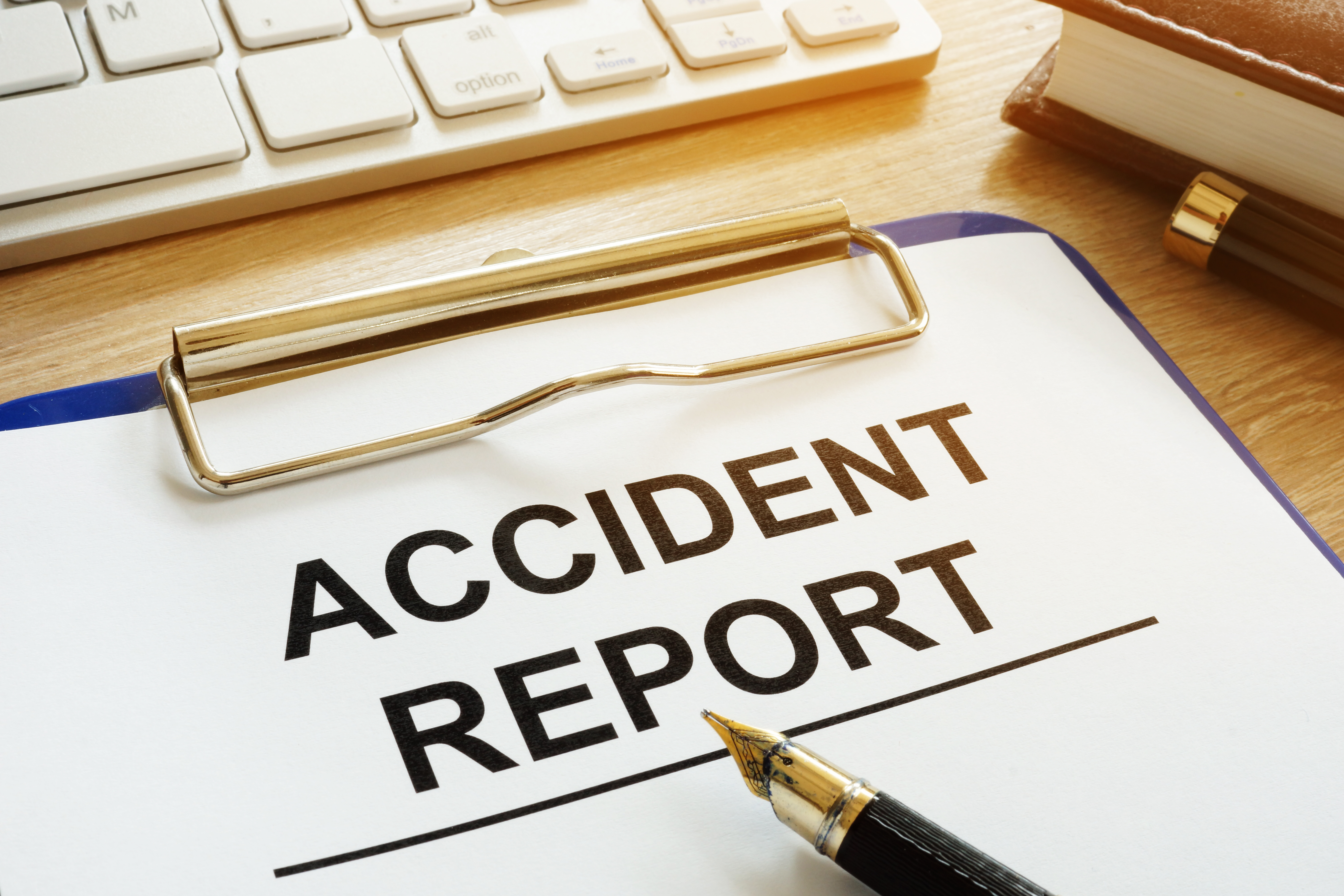 Illustration clip board with pen and the words accident report