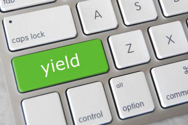 Computer keyboard with the word "Yield" in green as one of the keys