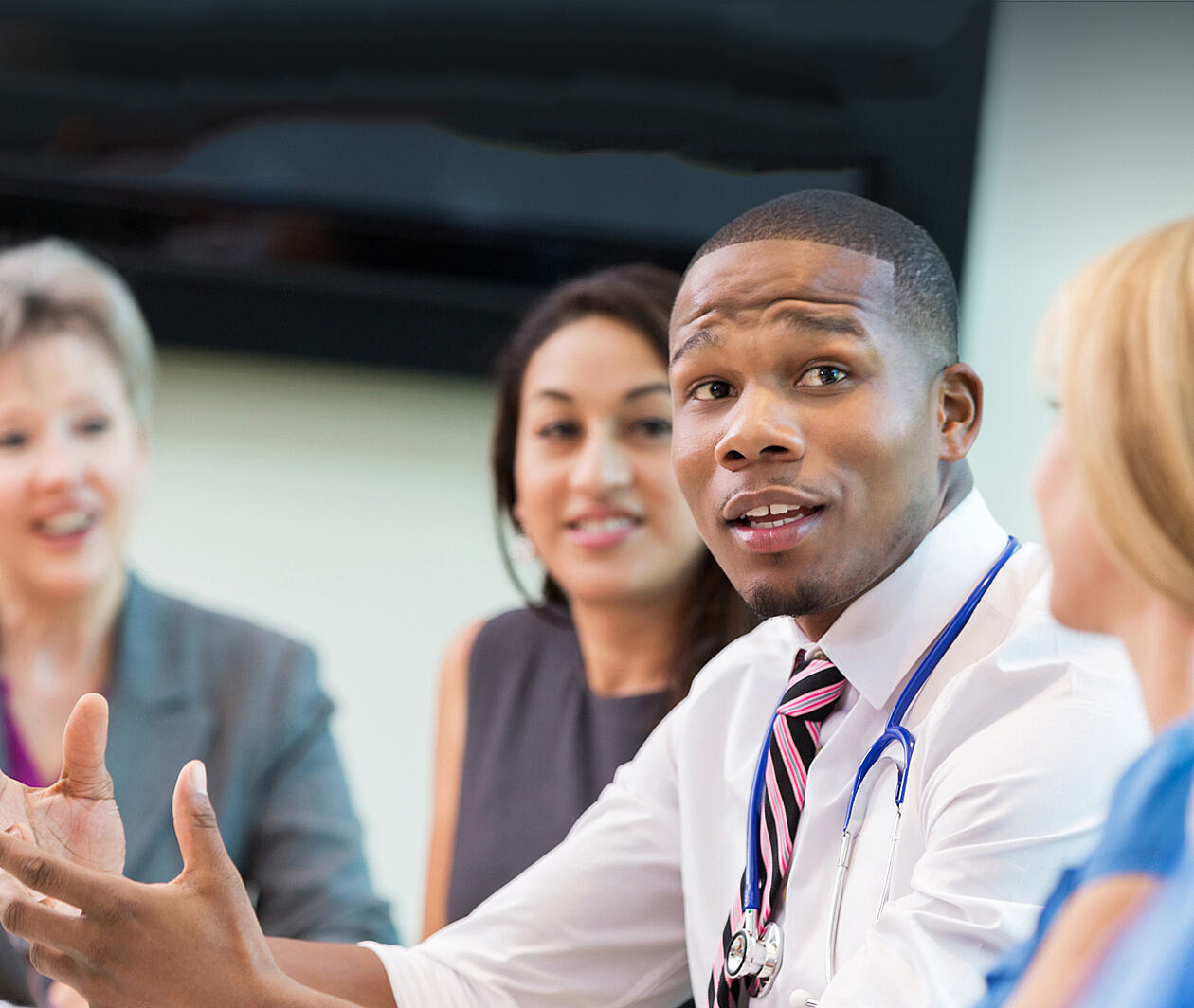 A group of healthcare professionals in conversation