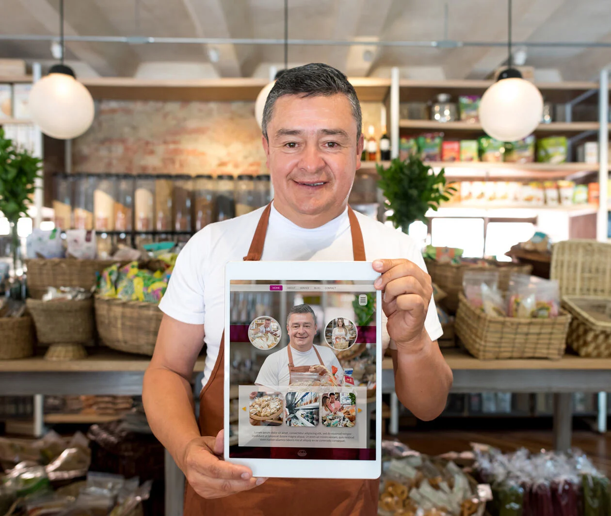 Restaurant owner holding ipad with their website