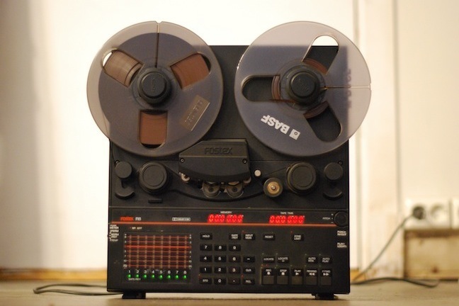 An 8-track tape recorder placed on the floor.