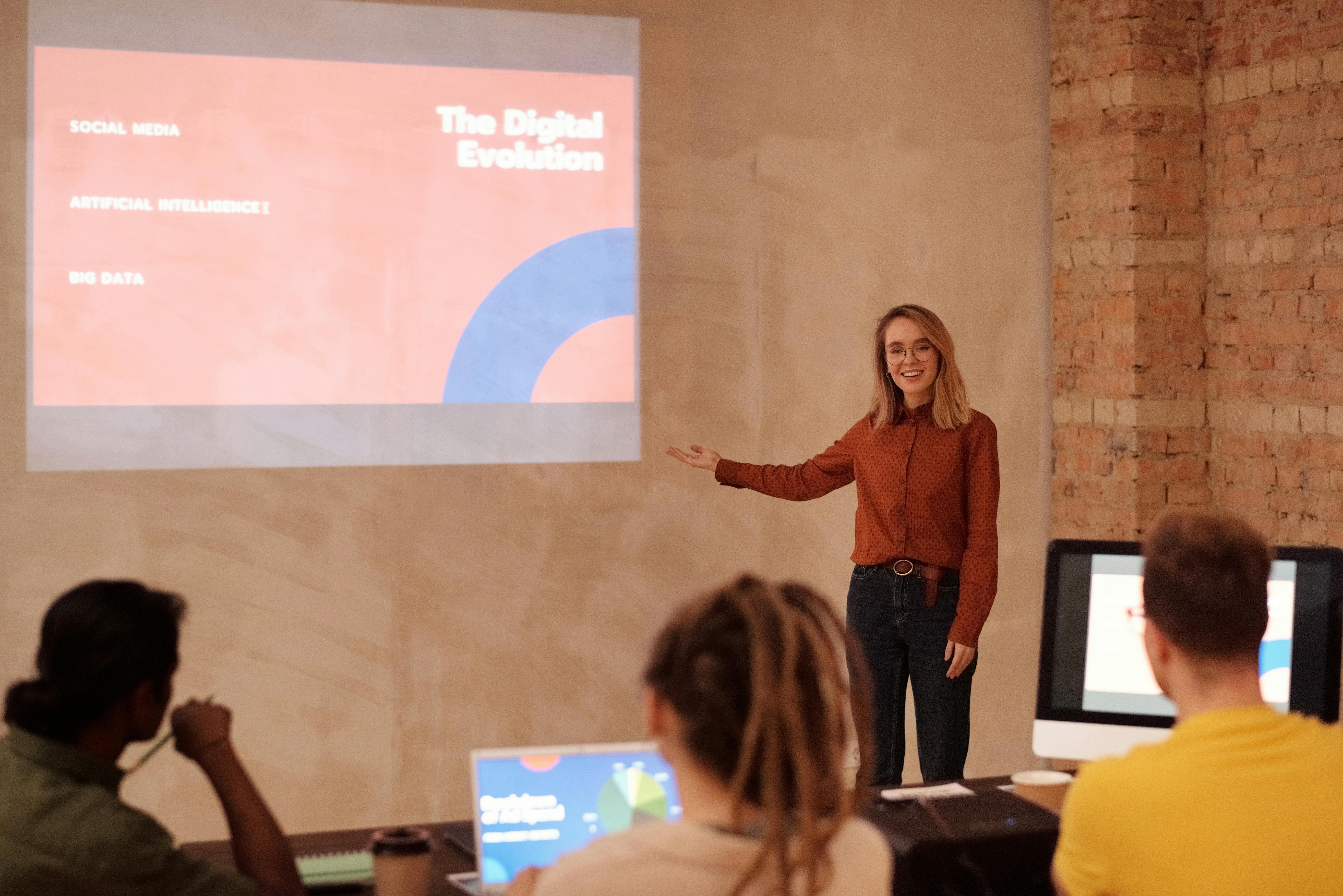 Woman presenting on digital evolution.