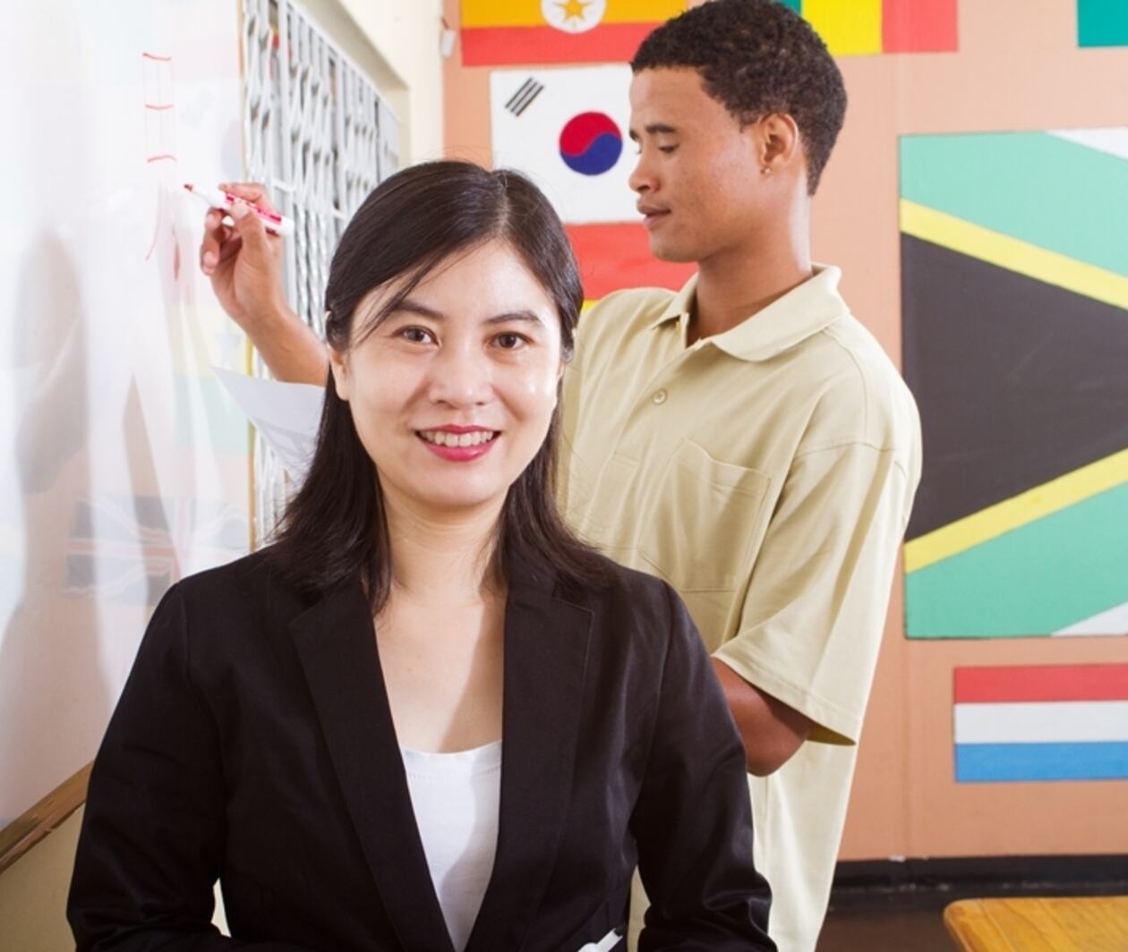 A teacher and a student in a classroom 