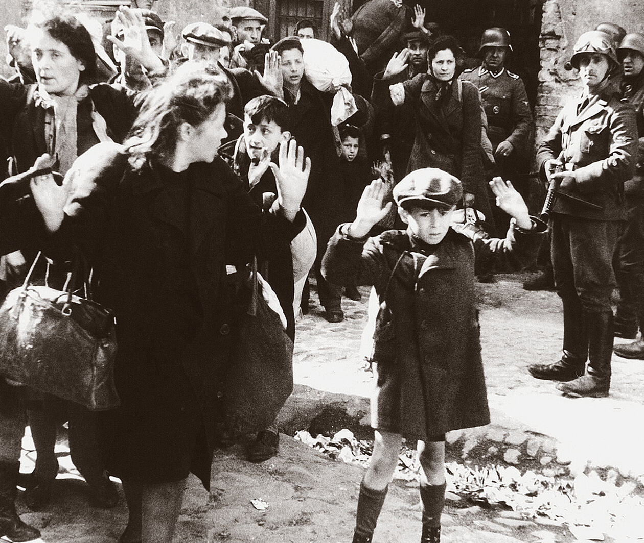 Families with young children surrendering with hands raised