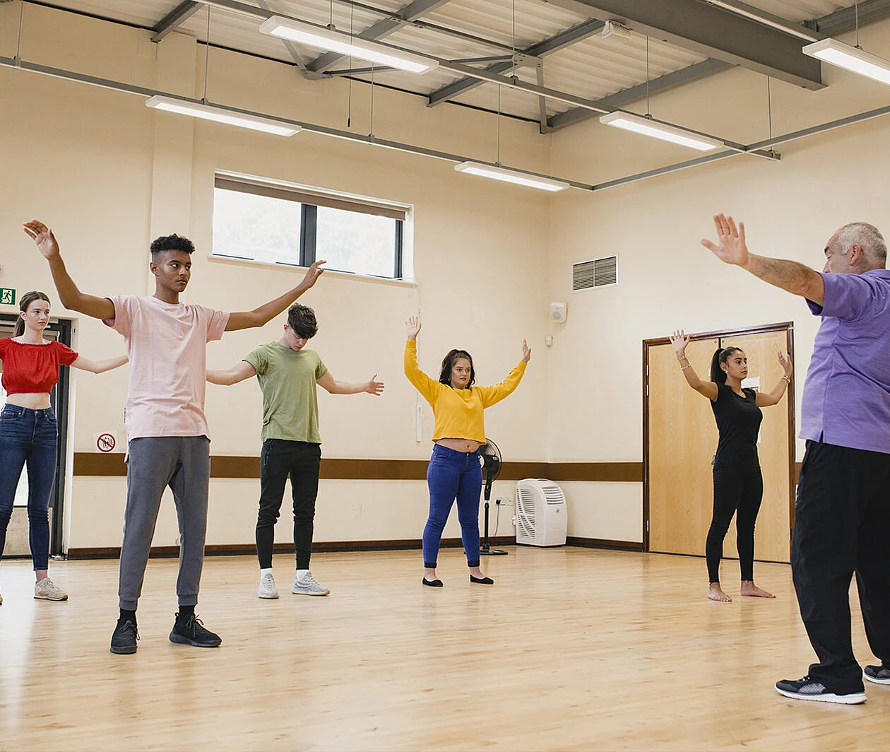 Young adults doing relaxation exercises