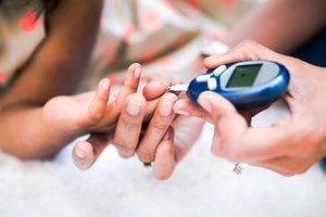 Picture of pair of hands and insulin pen