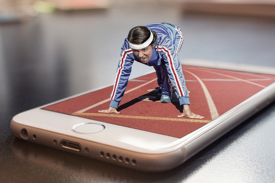 Enthusiastic runner on phone