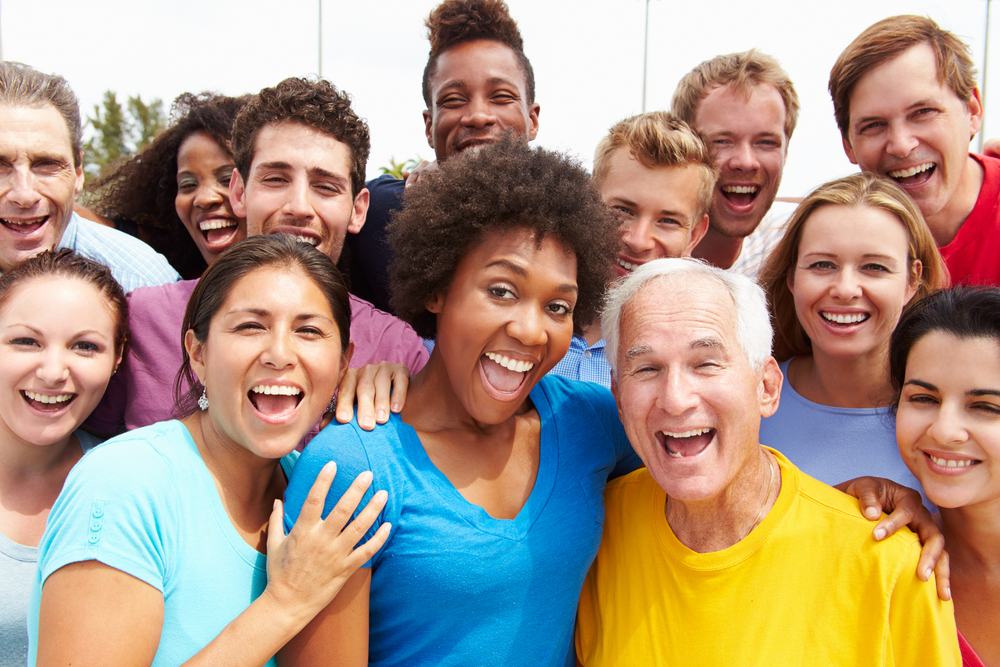 A diverse range of happy smiling people