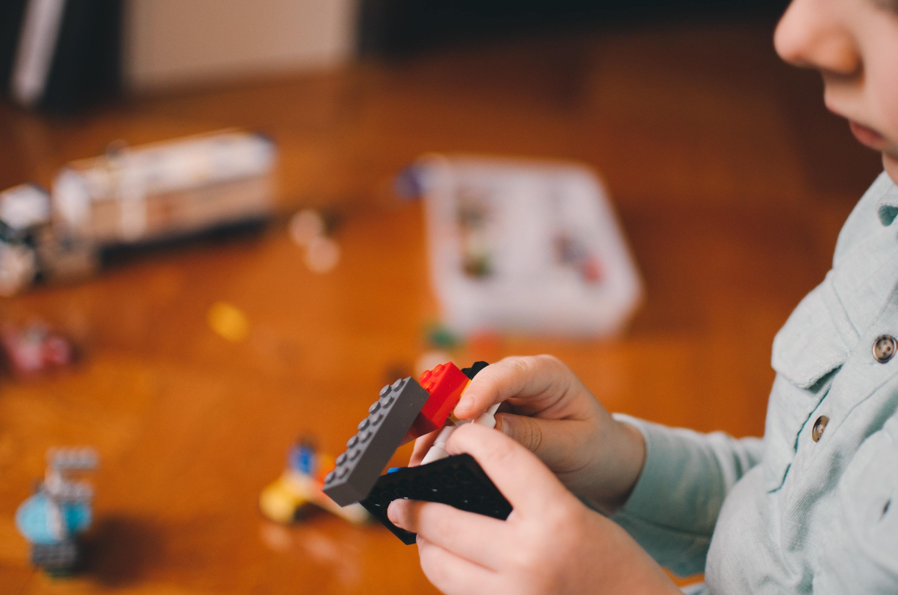 A child playing with Lego bricks