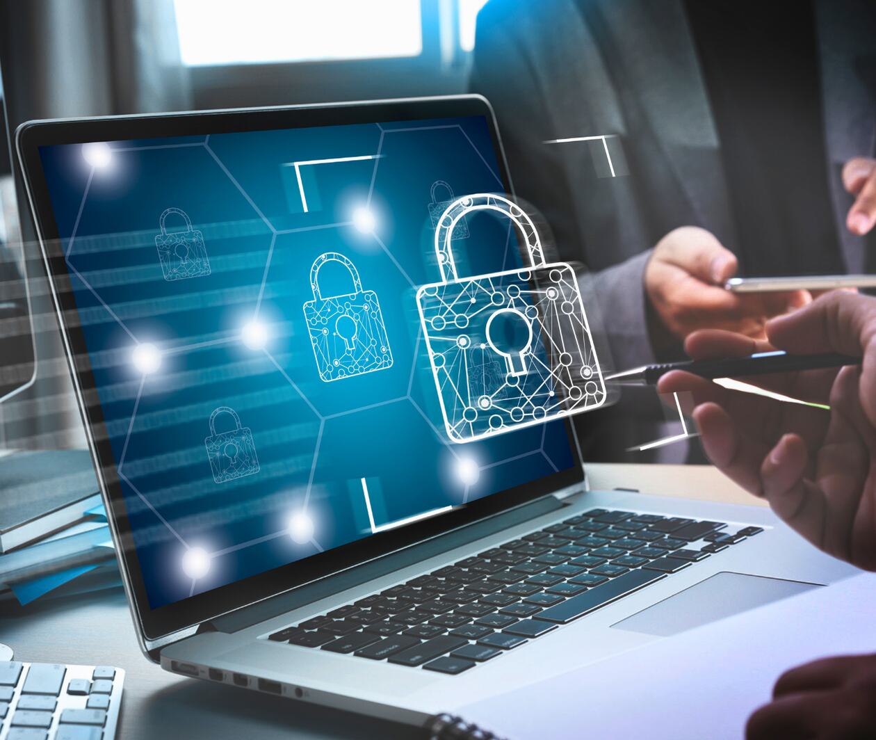 A laptop with a virtual padlock in front of the screen