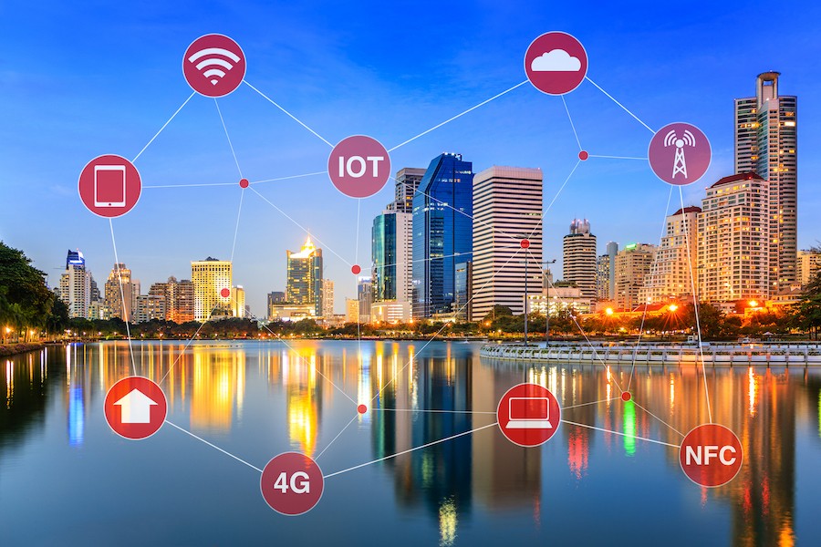 Icons floating above a cityscape representing connected services in a smart city