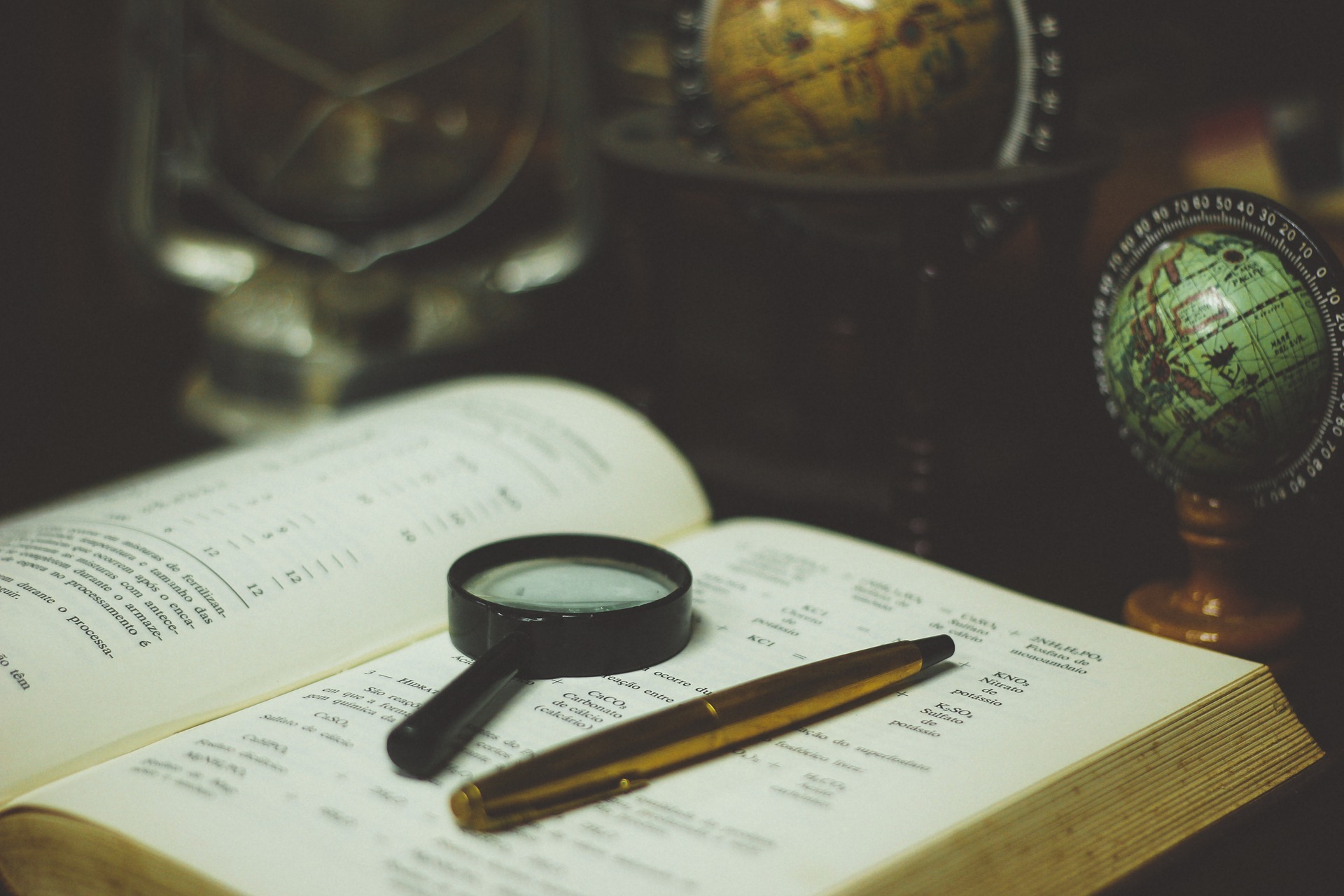 magnifying glass on top of a book