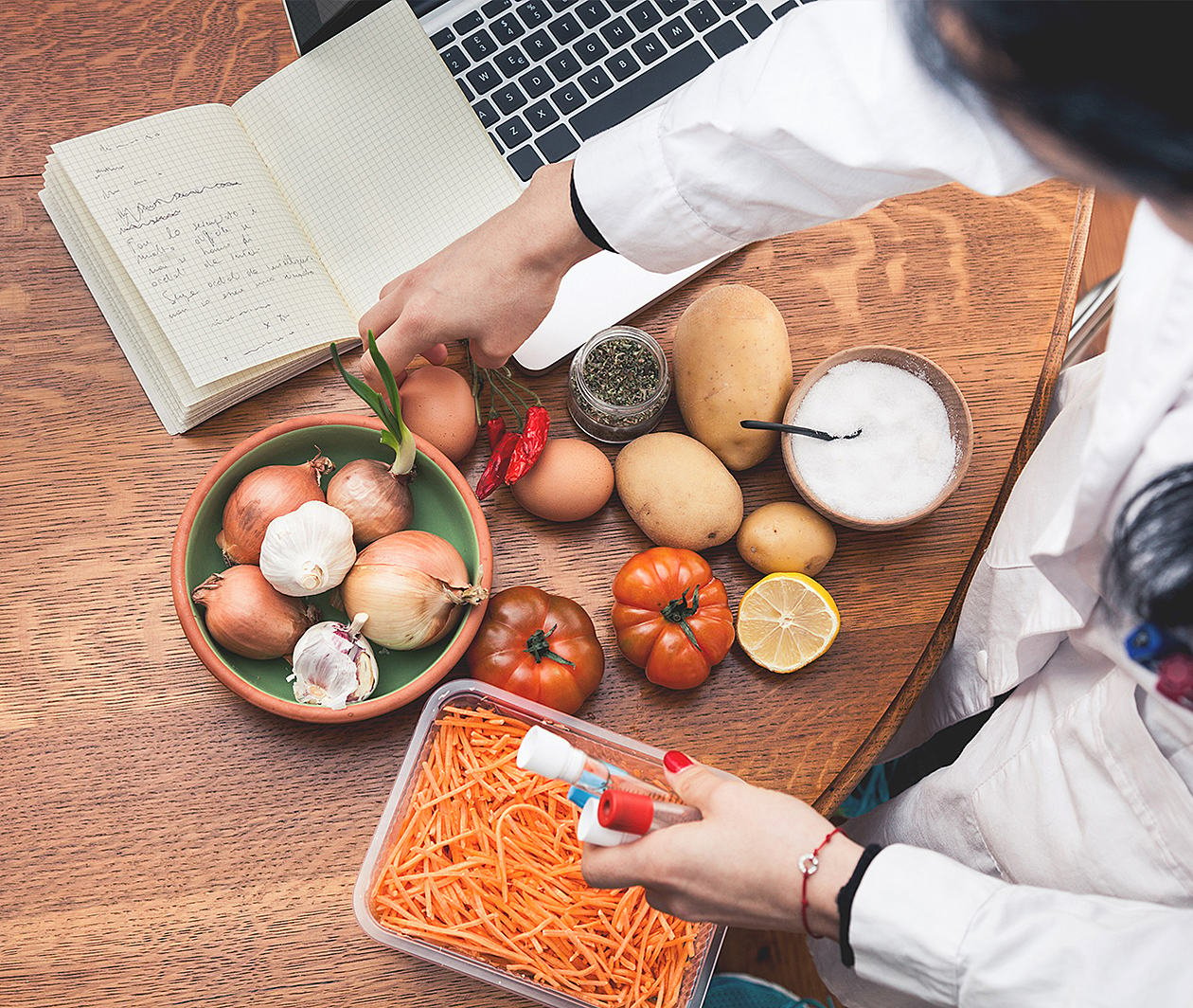 A scientist looking at different vegetables